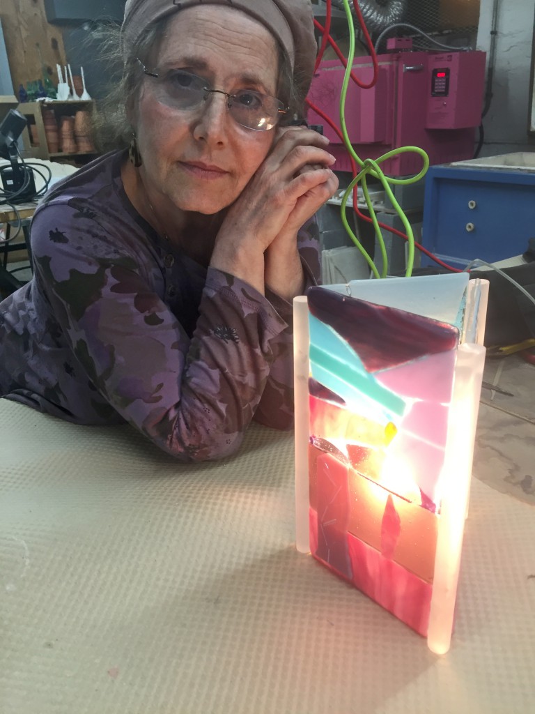 Jerrelee loves her light fixture that relates to her artwork.