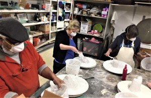 The eco students learn how to make hand built refractory molds for glass casting.
