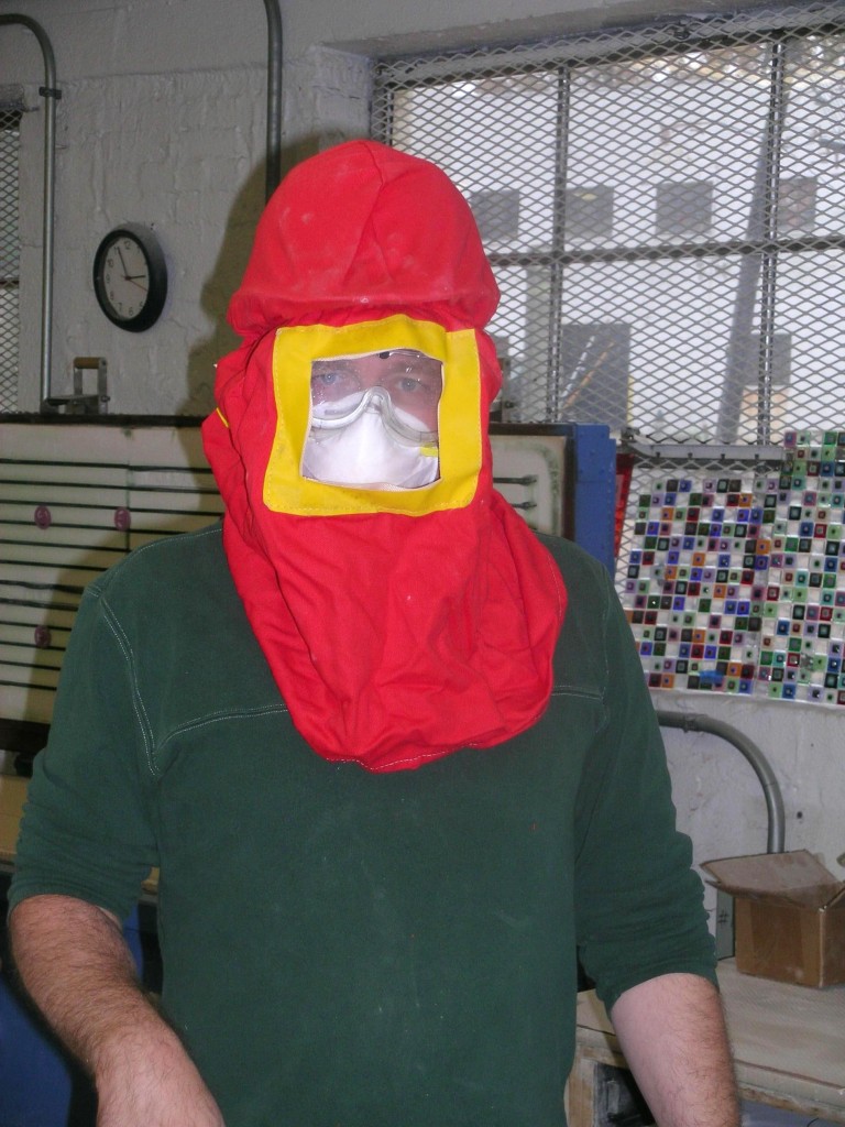 Erwin Timmers suits up in his PPE gear to work in the studio.
